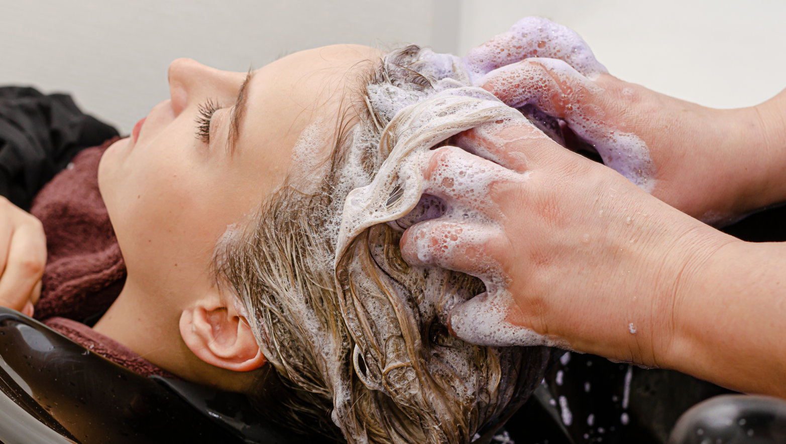 hair being washed at a salon