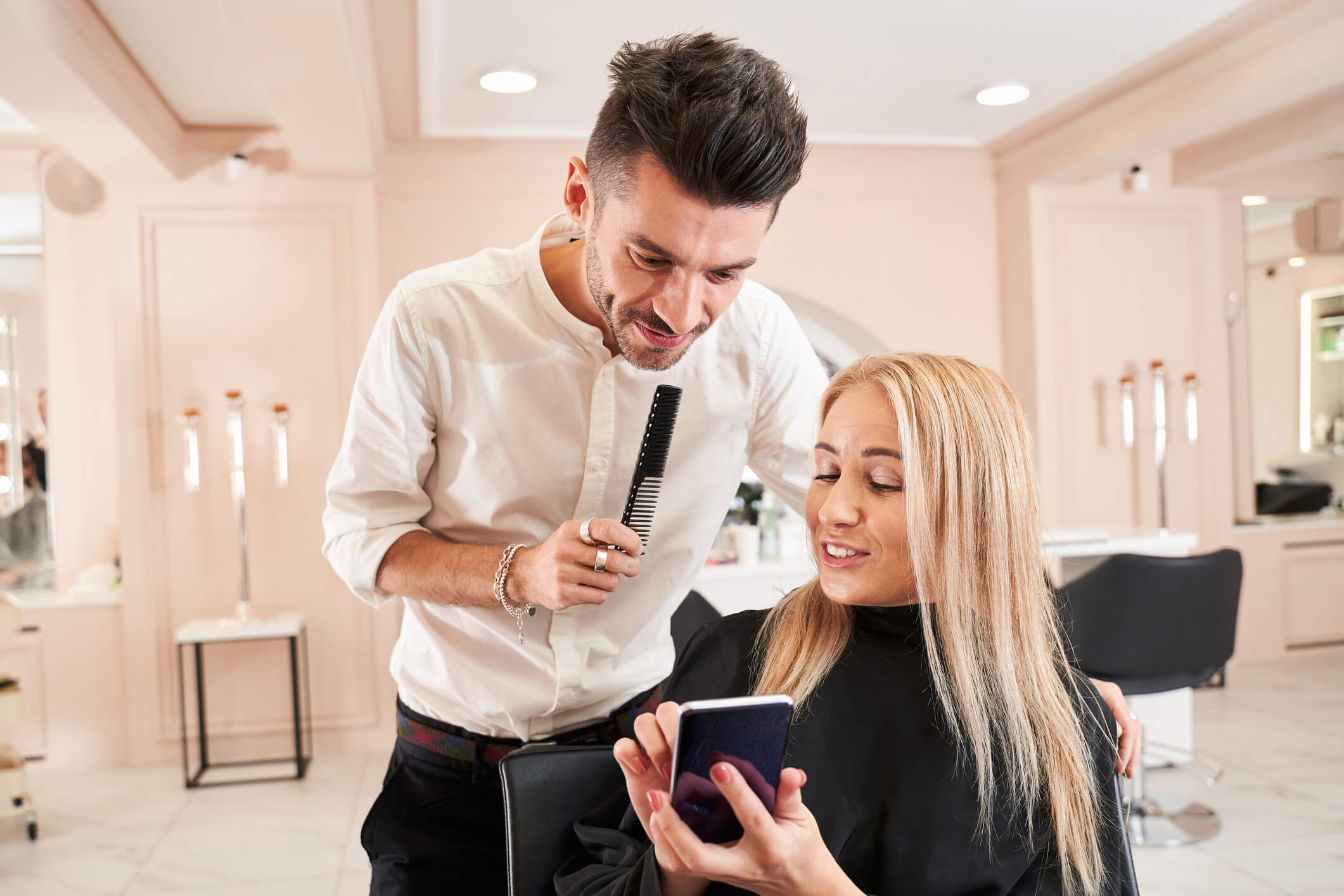 Image of a male stylist and female client