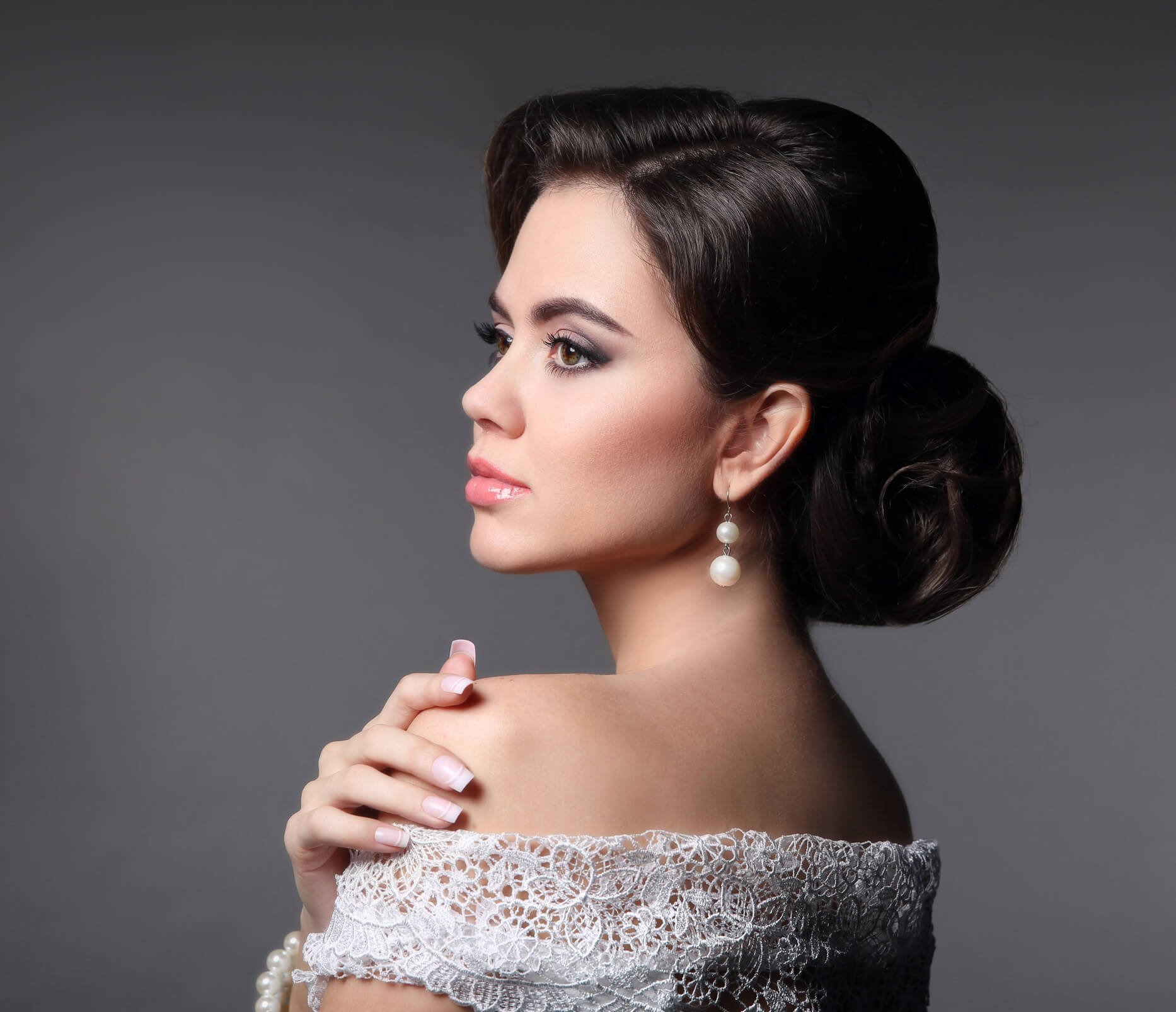 Image of a young woman with styled hair and makeup