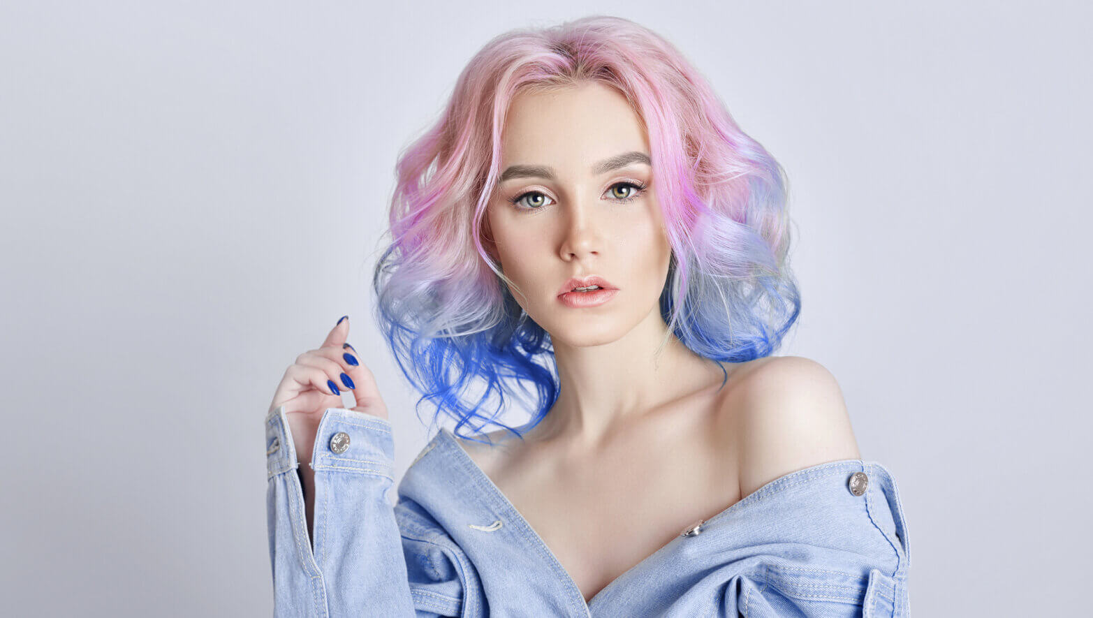 Image of a woman with pink, purple, and blue hair