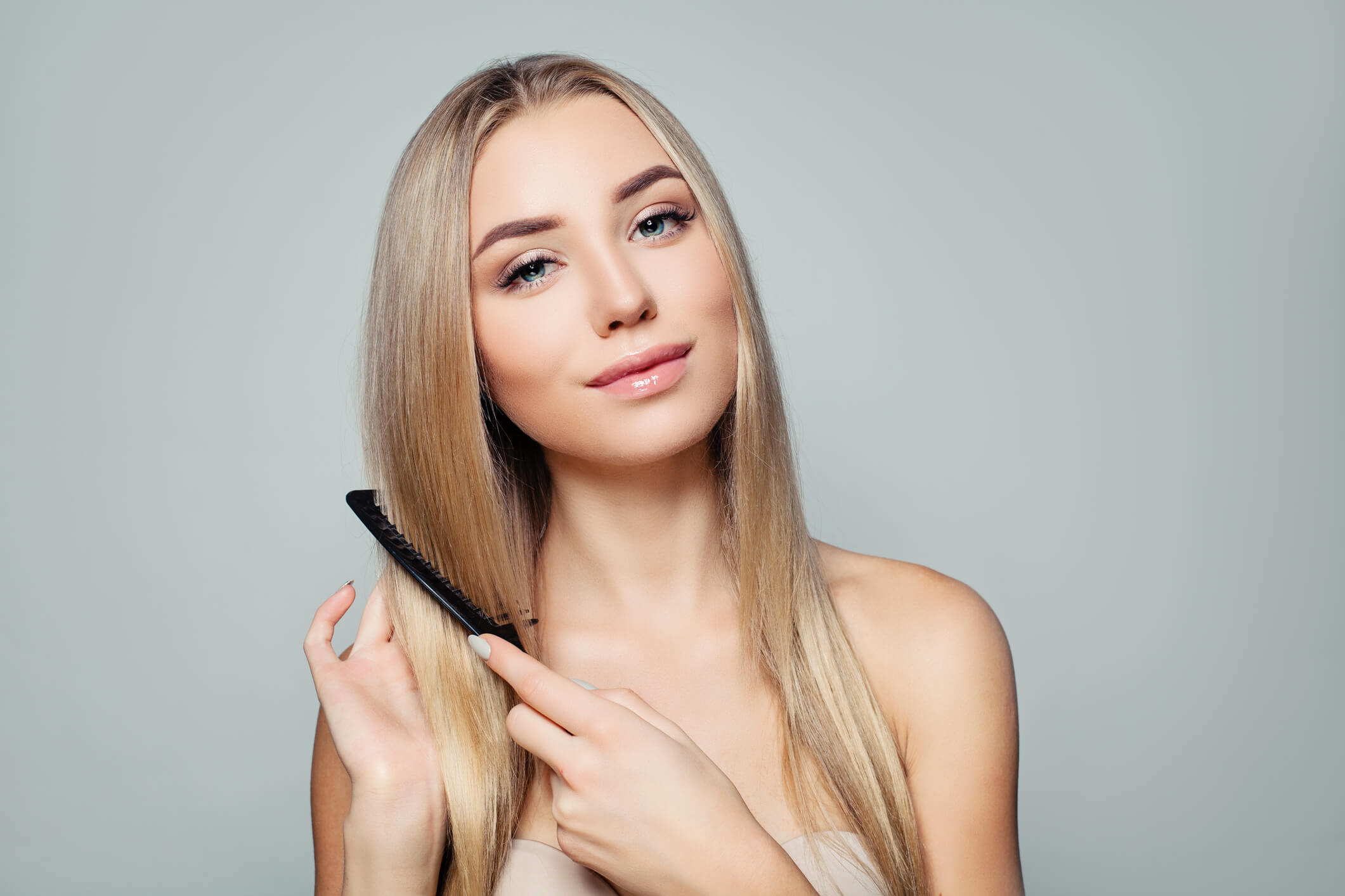 beautiful-blonde-woman-long-healthy-straight-hair-combing-hair-haircare-concept-girl-combs-hair-beautiful-blonde-woman-image