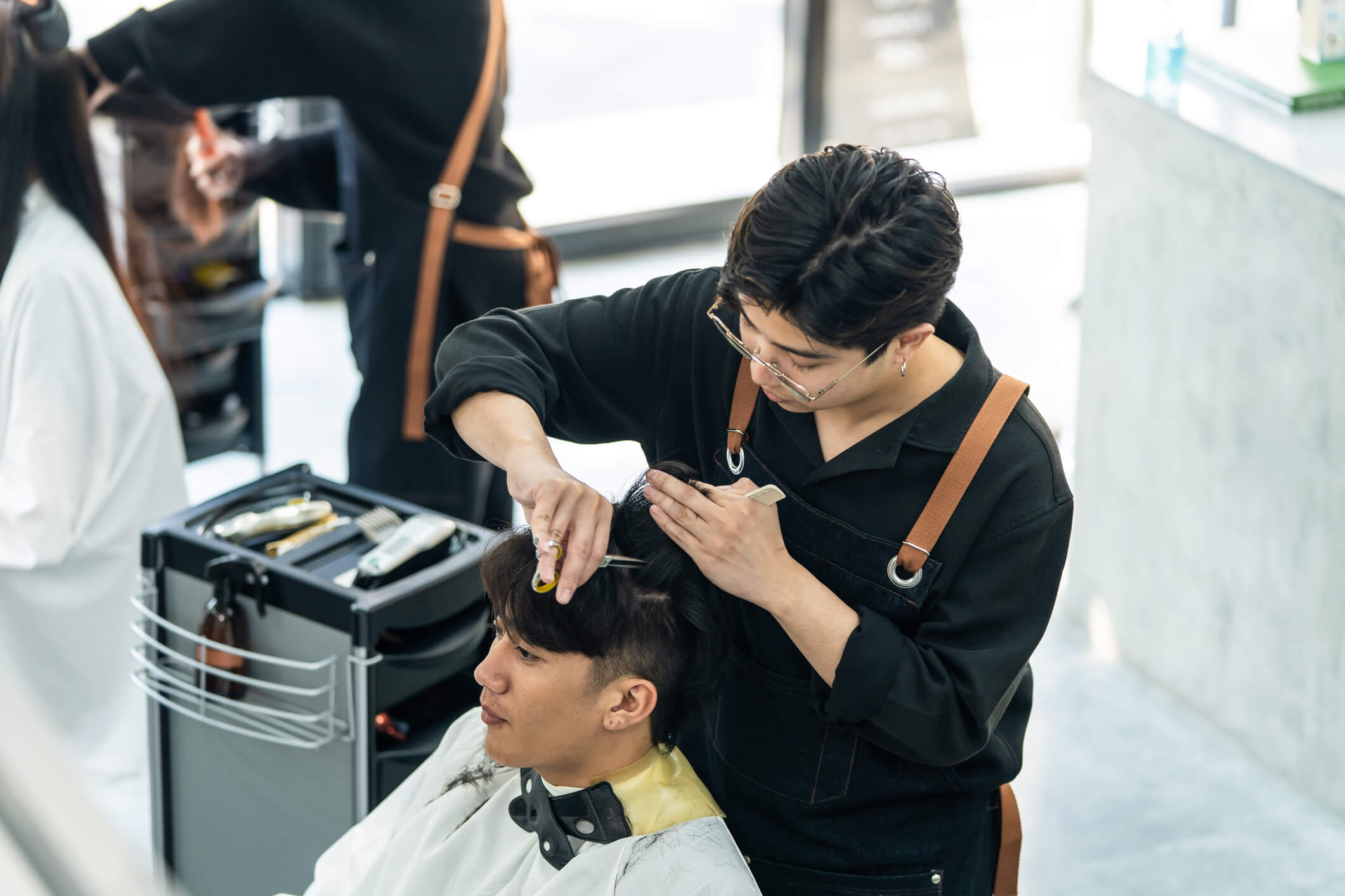 asian-hairdresser-barber-male-cut-hair-attractive-man-salon-shop-professional-hairstylist-combing-using-scissors-give-image