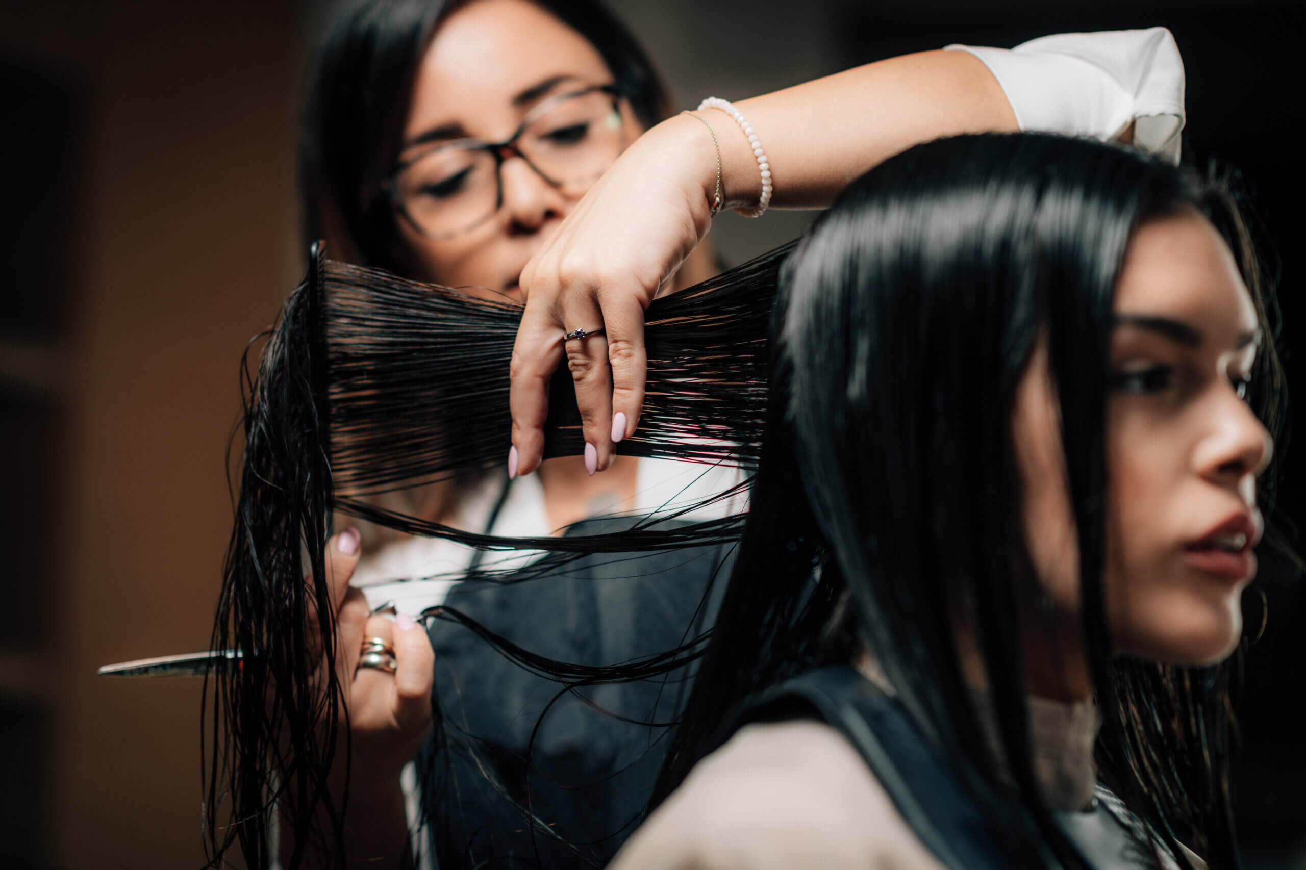 hairstylist cutting client's hair