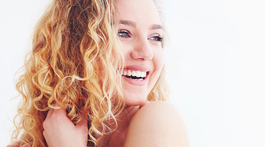 happy woman curly hair