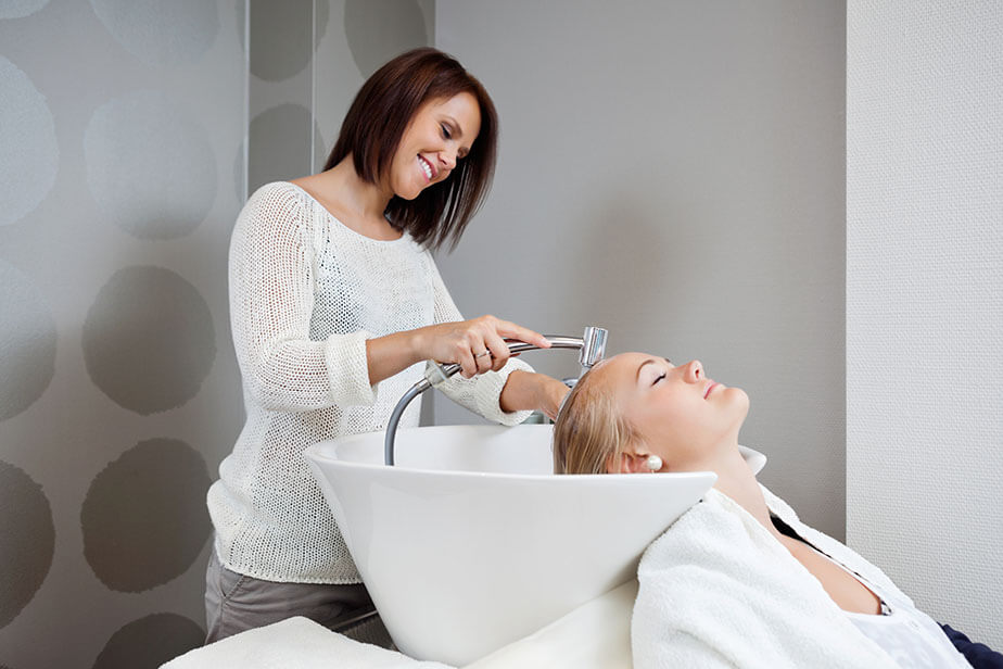 washing client hair in salon sink