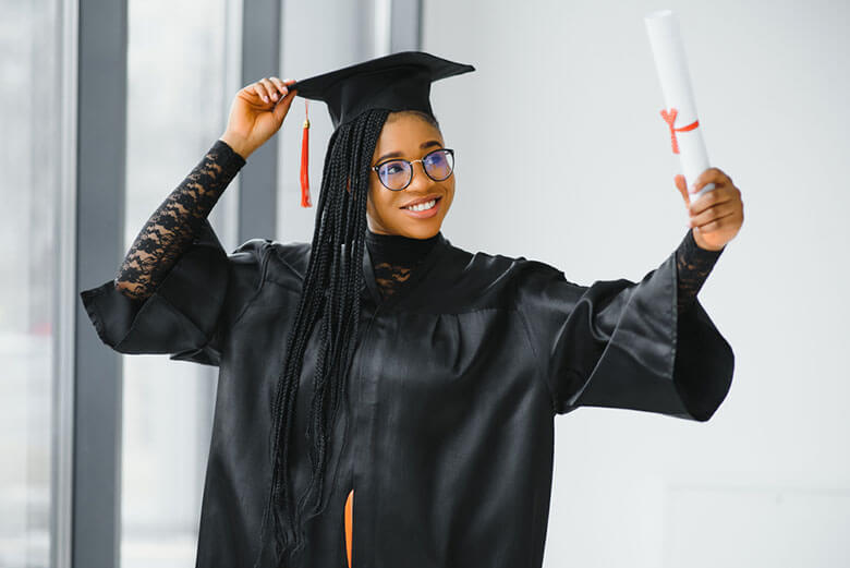 woman posing with diploma