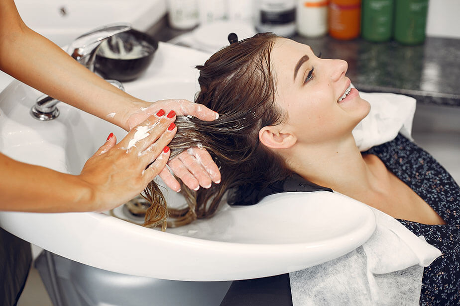 stylist washing client hair