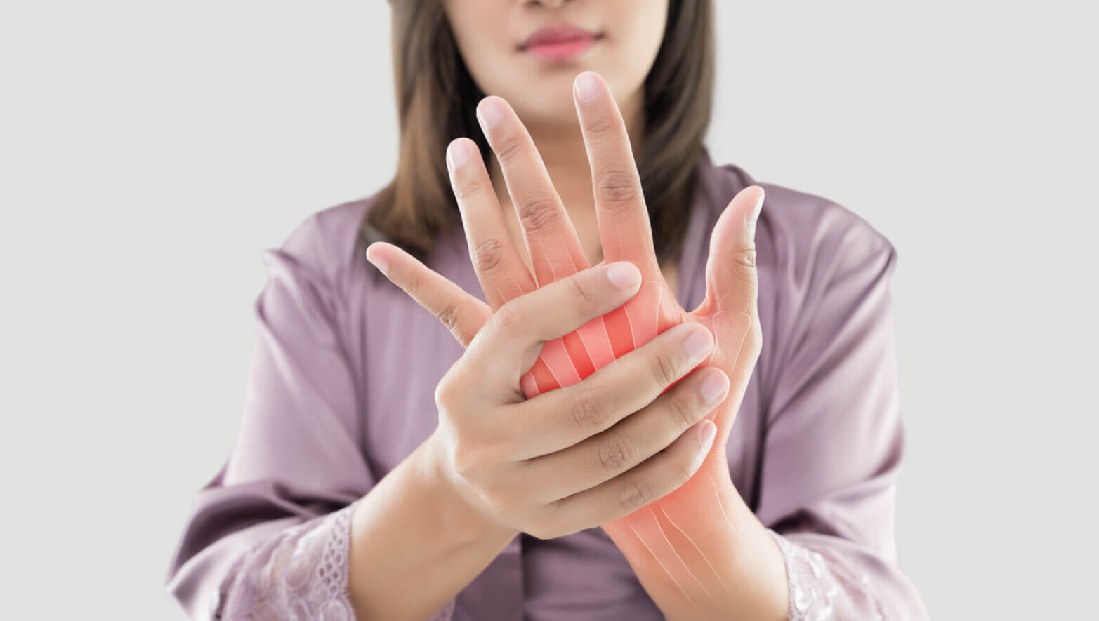 woman-hand-pain-asian-suffering-bone-against-gray-background-concept-arthritis-grimace