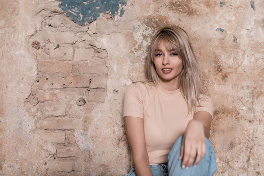 portrait woman with blonde layered hair