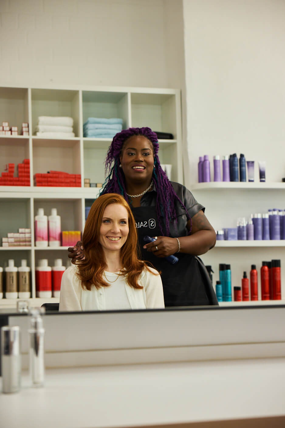 stylist smiling with client