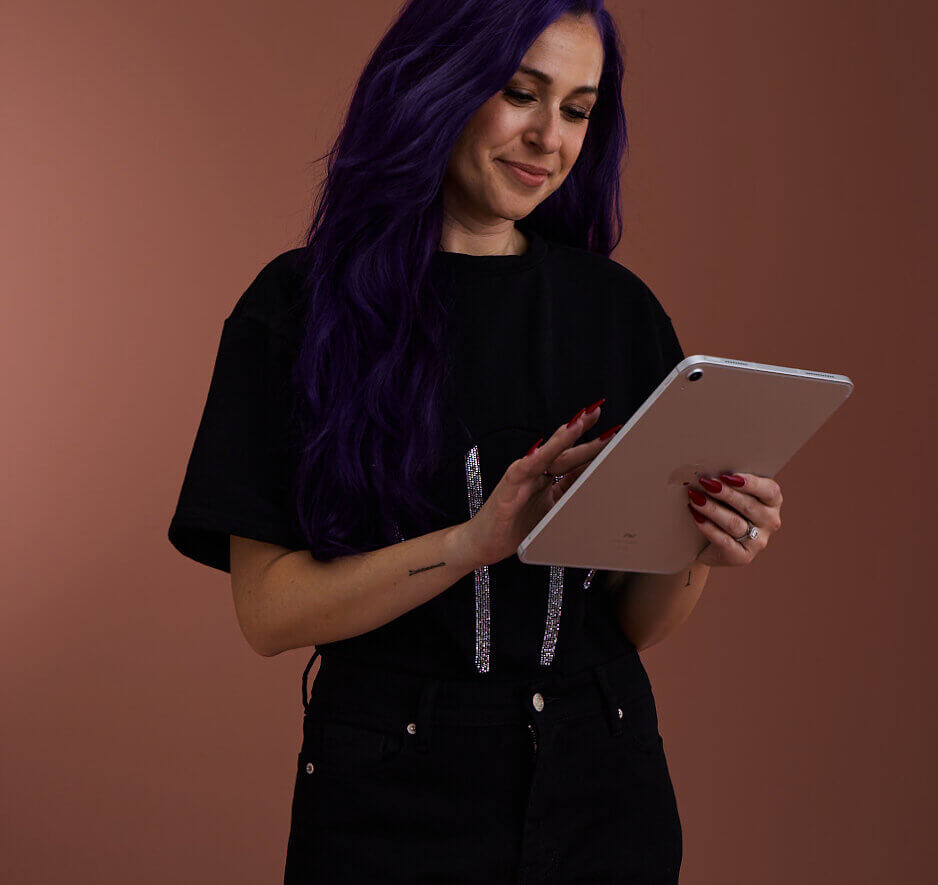 stylist holding an ipad